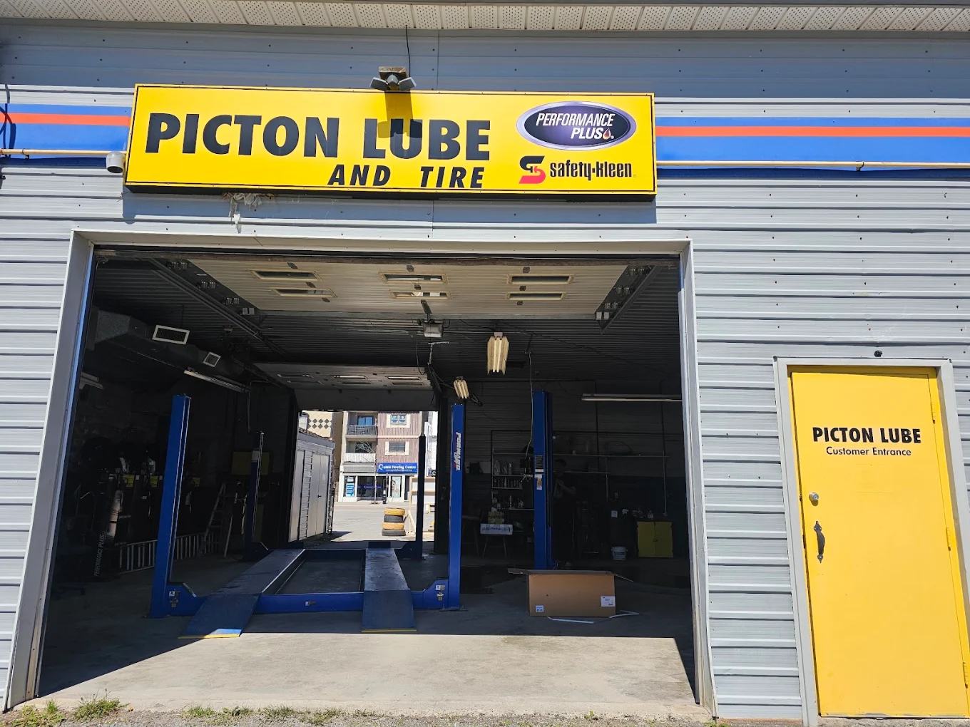 Open service bay with lifts at Picton Lube and Tire